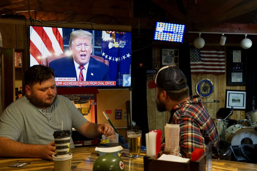 People watch Trump&amp;#039;s speech on TV in Encitas, California