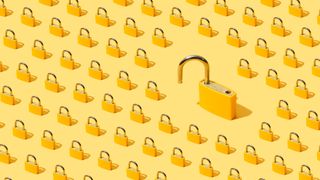 A graphic of dozens of locked, gold padlocks on a pale yellow background, lined up in rows and viewed with an isometric view to represent cyber security. To the right of the frame there is one especially large, unlocked padlock. They are set against a pale yellow background.