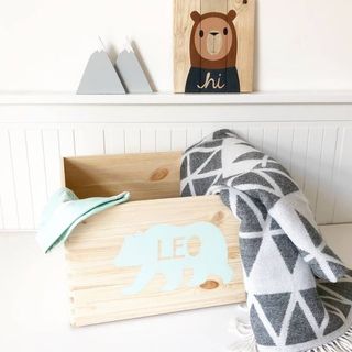 Peronalised toy boxes illustarted by beauticul carved toy boxes in white