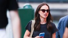 natalie portman wearing black tshirt and sunglasses 