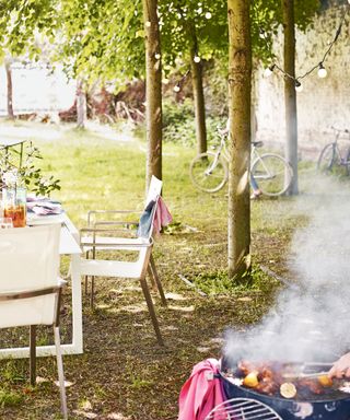 casual barbecue set-up in garden