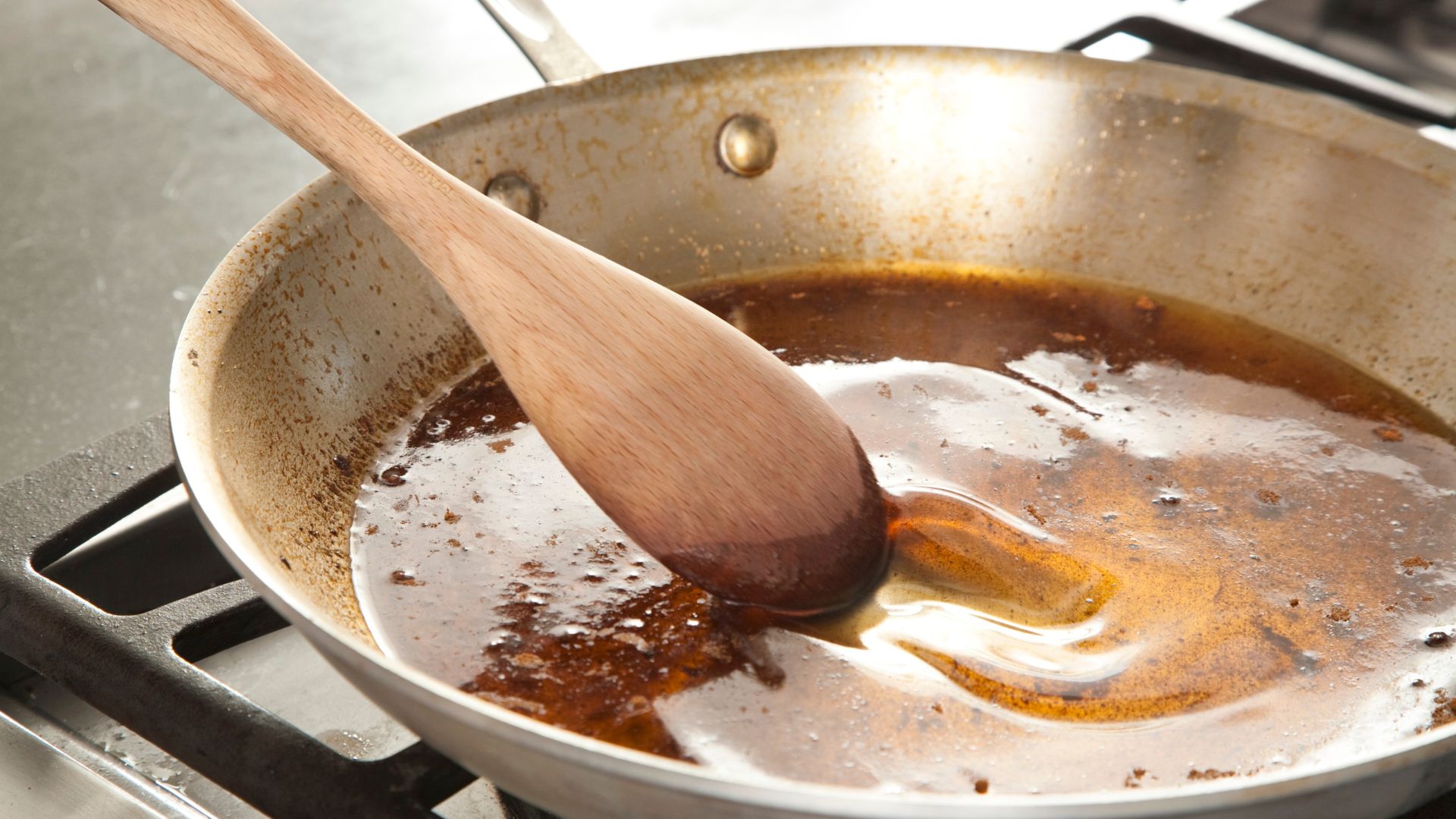 Person deglazing a pot