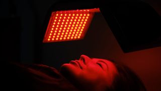 A woman having red light therapy