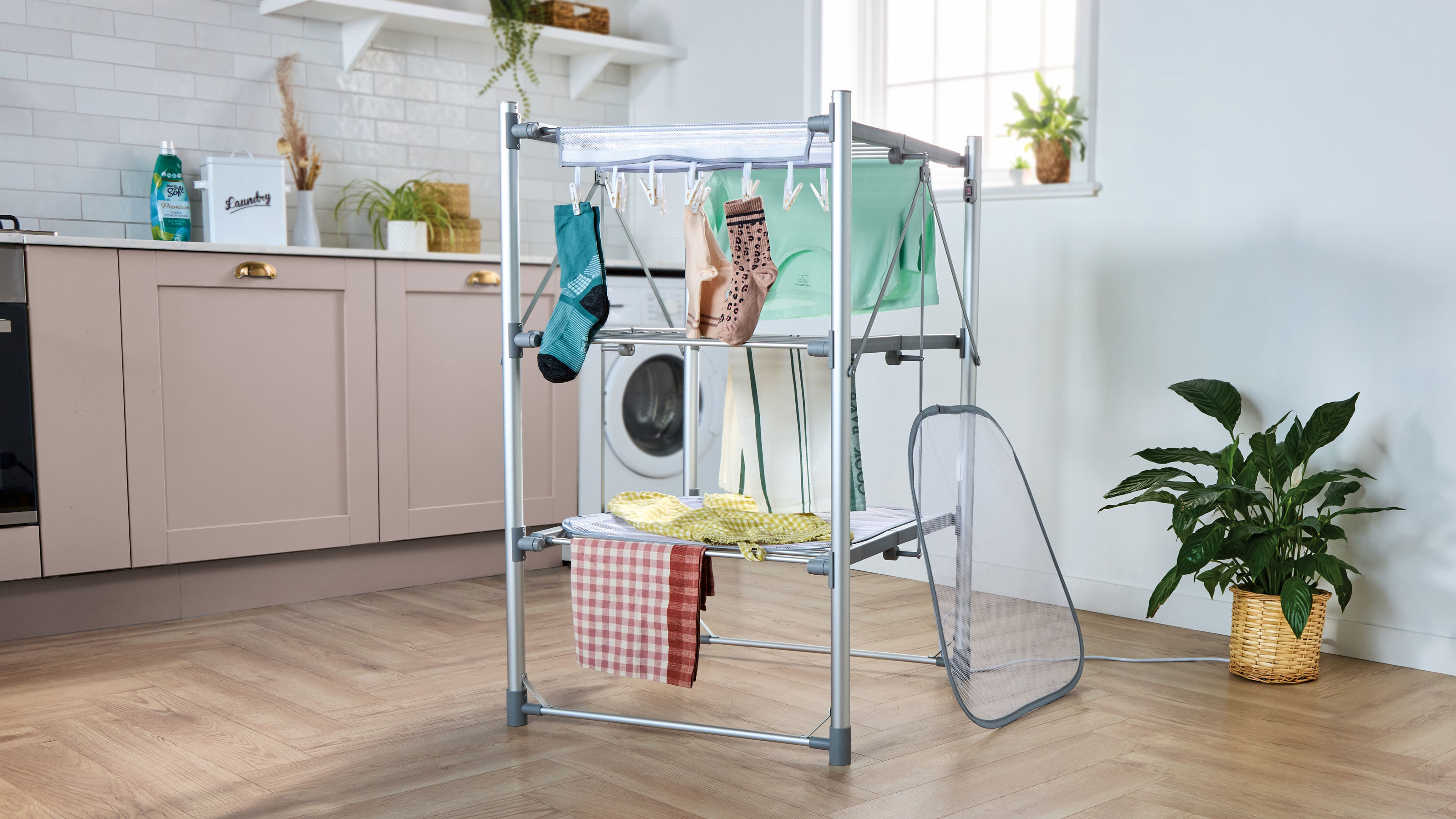 Aldi heated airer in a pink utility room 
