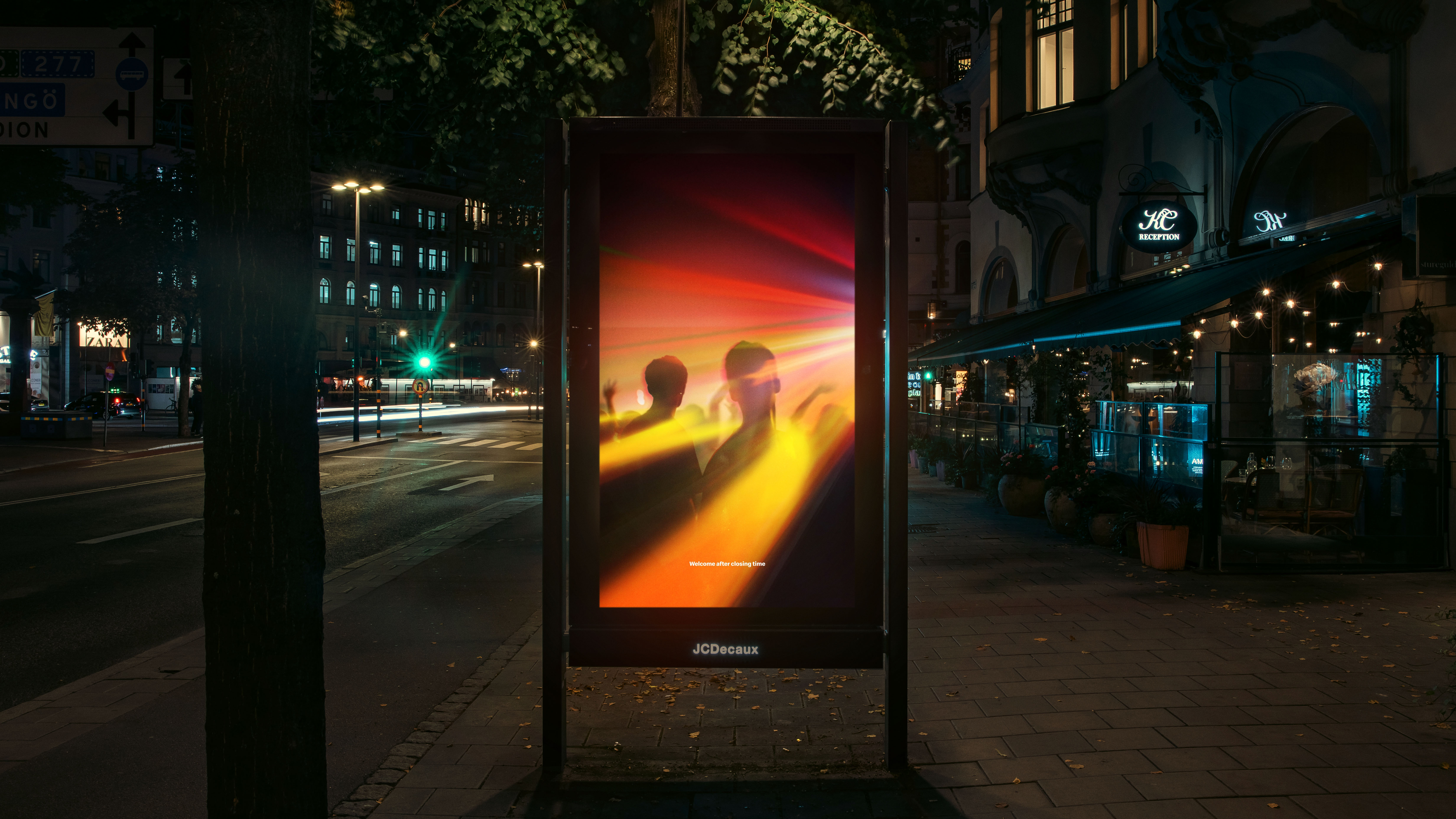 An image of a poster on a bus shelter showing a McDonald's advert featuring an optical illusion in which the Mcdonald's logo looks like lights shining on the floor in a nightclub
