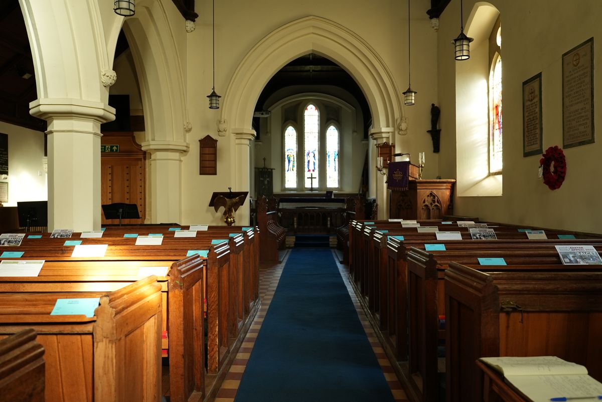 The inside of a Church between the pews