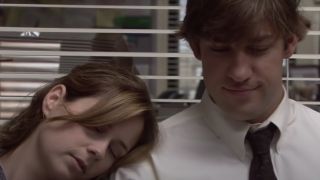 Pam resting her head on Jim's shoulder in The Office