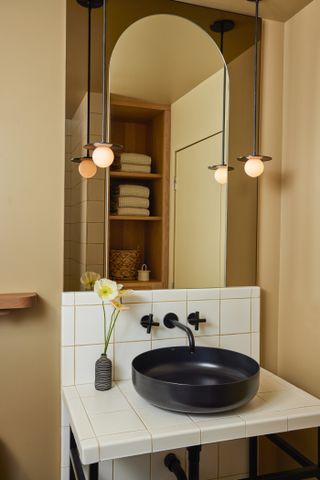 a small bathroom with curved countertop