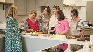 The whole woman&home festive food testing team deliberating over the festive bakes and desserts of 2023