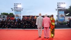 Tilda Swinton, Pedro Almodóvar and Julianne Moore pose on the red carpet before a screening of "The Room Next Door" at the 81st Venice International Film Festival