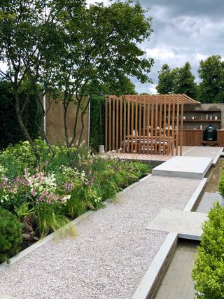 straight gravel path at The Viking Friluftsliv Garden designed by Will Williams for Hampton Court Garden Festival 2021