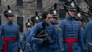 Edgar Allan Poe (Harry Melling) in uniform with other cadets in The Pale Blue Eye