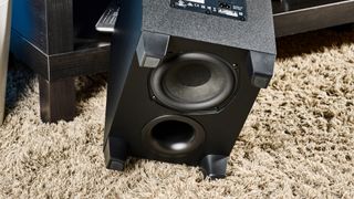 The Polk Audio Signa S4 subwoofer overturned to show the speaker cone