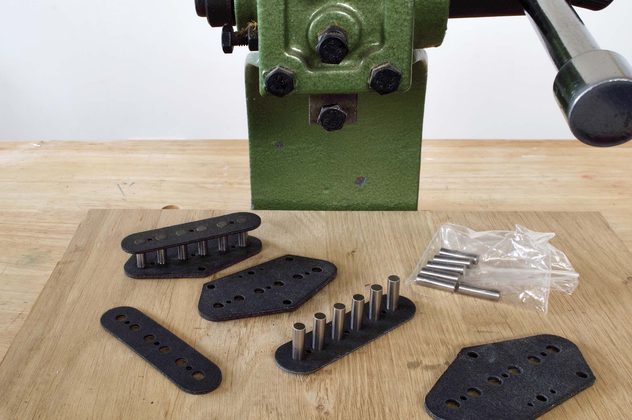 An arbour press makes it easy to assemble the bobbins, but a soft mallet can also be used