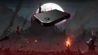A Steam Link glows in front of a gothic castle 