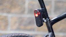 The Garmin Varia RCT715 mounted on a seatpost and lit up
