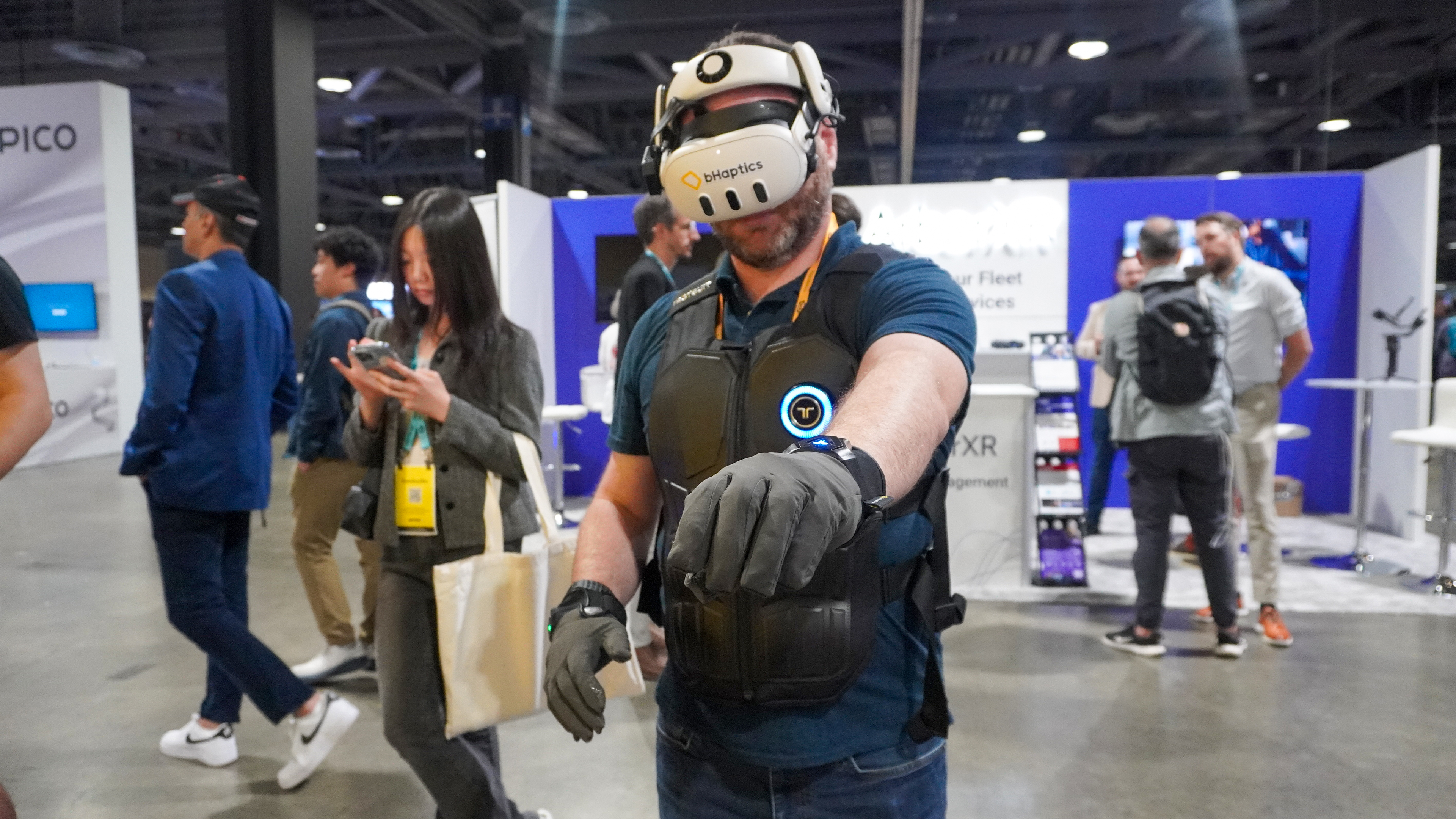 bHaptics Vr accessories: vest, gloves, sleeve with Meta headset at AWE 2025