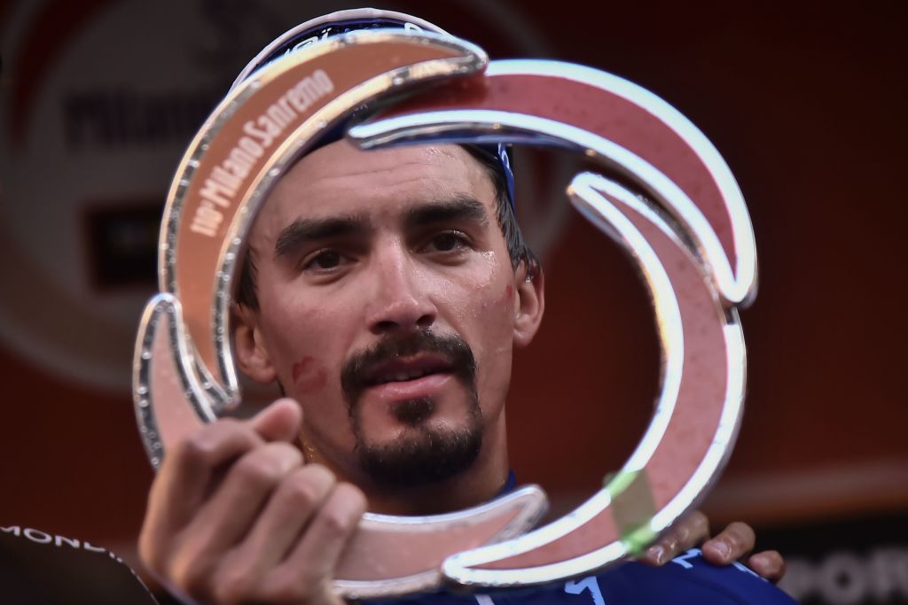 Julian Alaphilippe takes a look at his new trophy