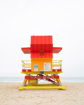 red and yellow Miami lifeguard tower