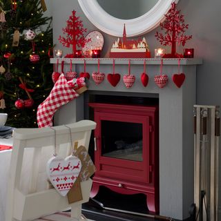 dining room with red wood burner and christmas decorations