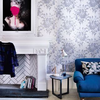 room with wallpaper and frame on wall and sweeter