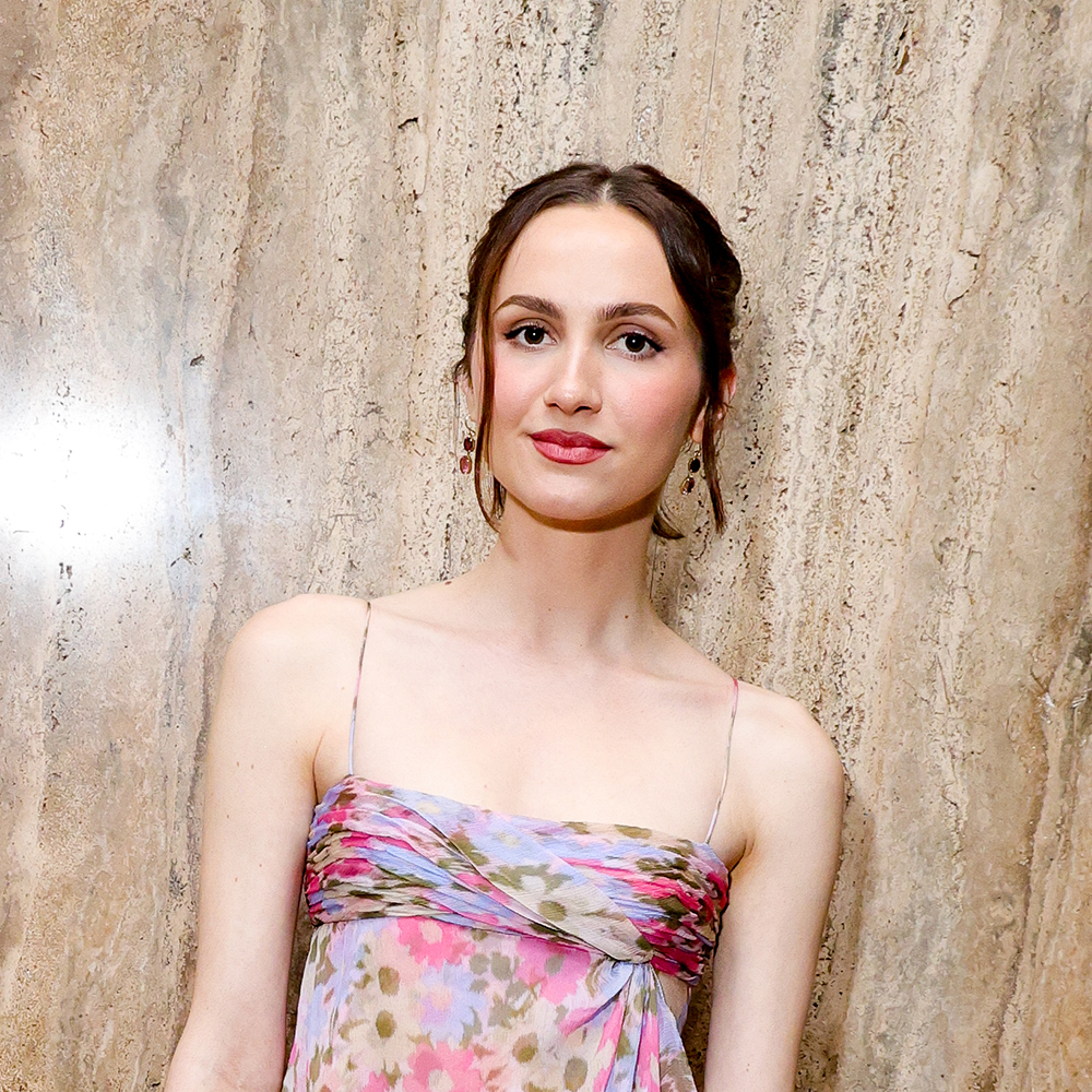 Maude Apatow wearing a pink floral dress and pink satin heels 