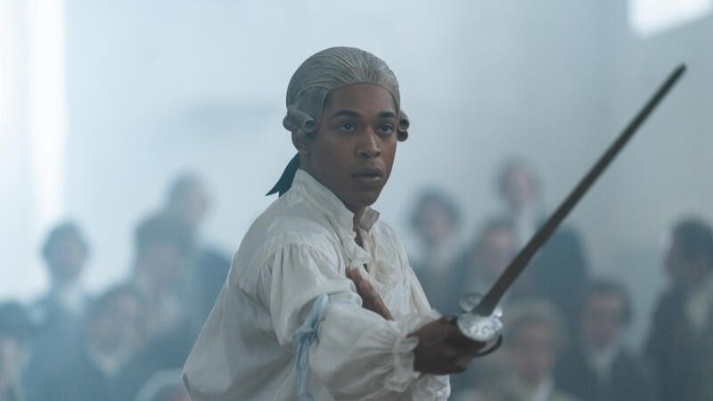 Kelvin Harrison Jr. holding a sword in Chevalier