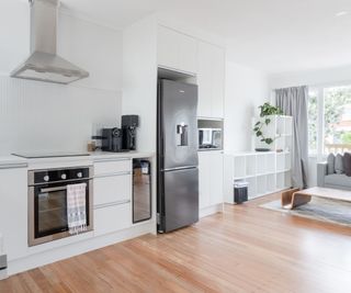 A kitchen with a silver refrigerator