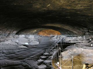 Researchers found evidence of human fire use in South Africa's Wonderwerk Cave (shown here), a massive cavern located near the edge of the Kalahari Desert.