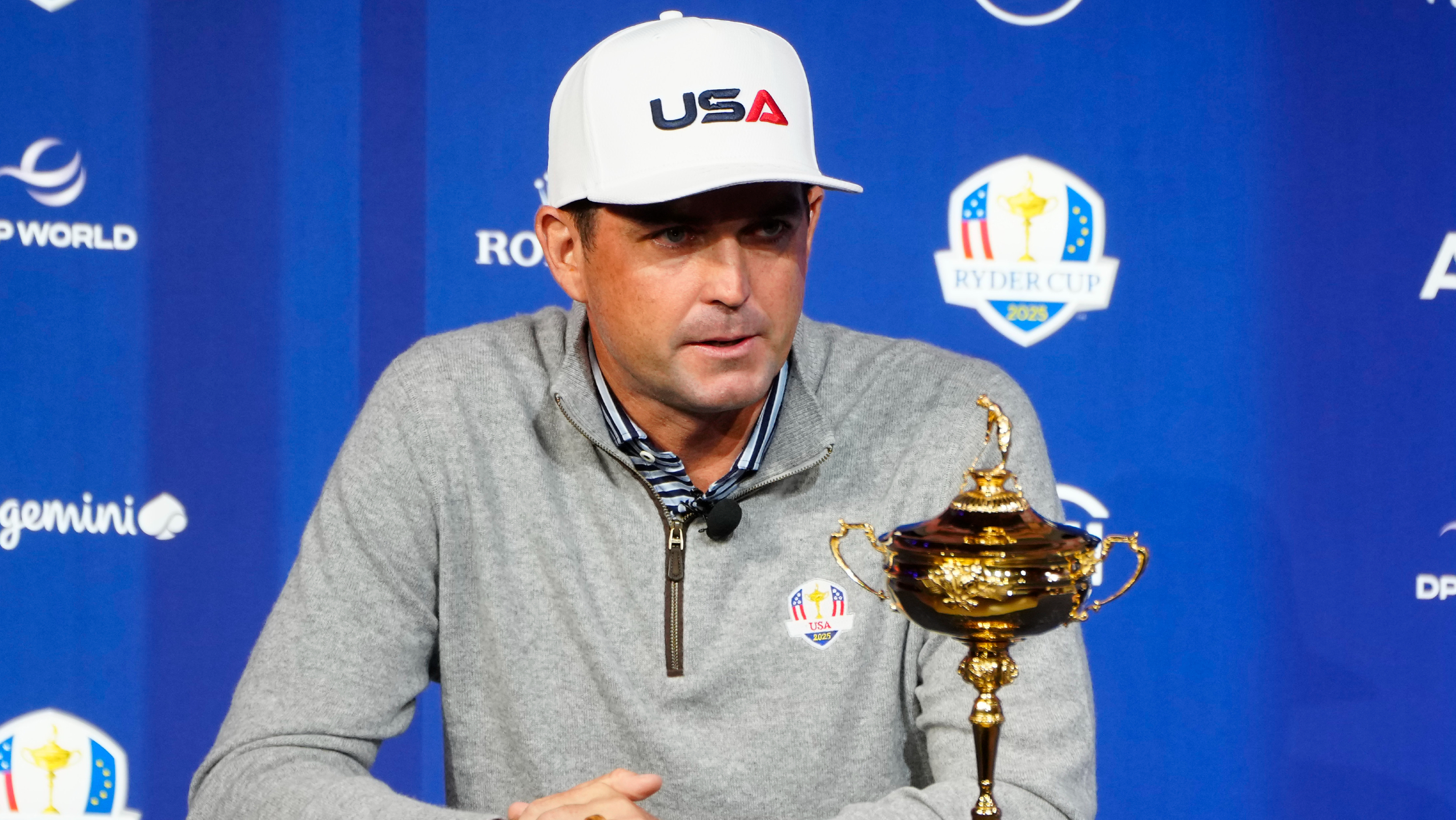 Keegan Bradley talks to the media with the Ryder Cup on display 