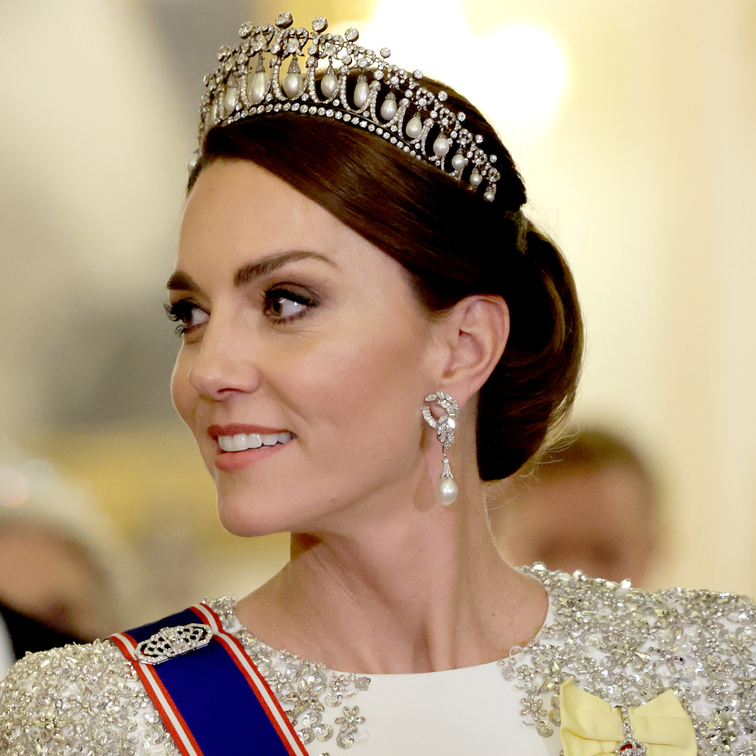 Kate Middleton wearing a white gown and tiara