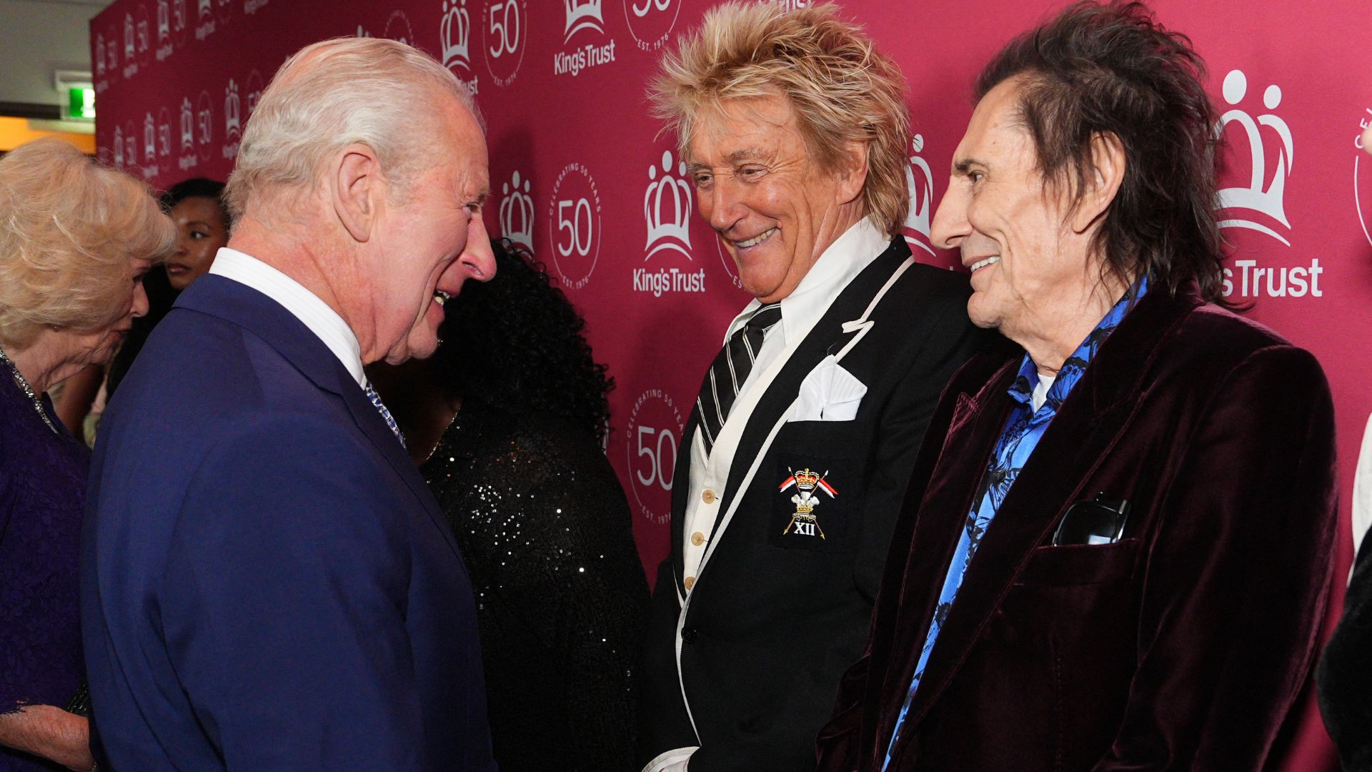 King Charles III speaks with British rock legends Rod Stewart and Ronnie Wood as he arrives to attend A King's Trust celebration at the Royal Albert Hall in London on May 11, 2026
