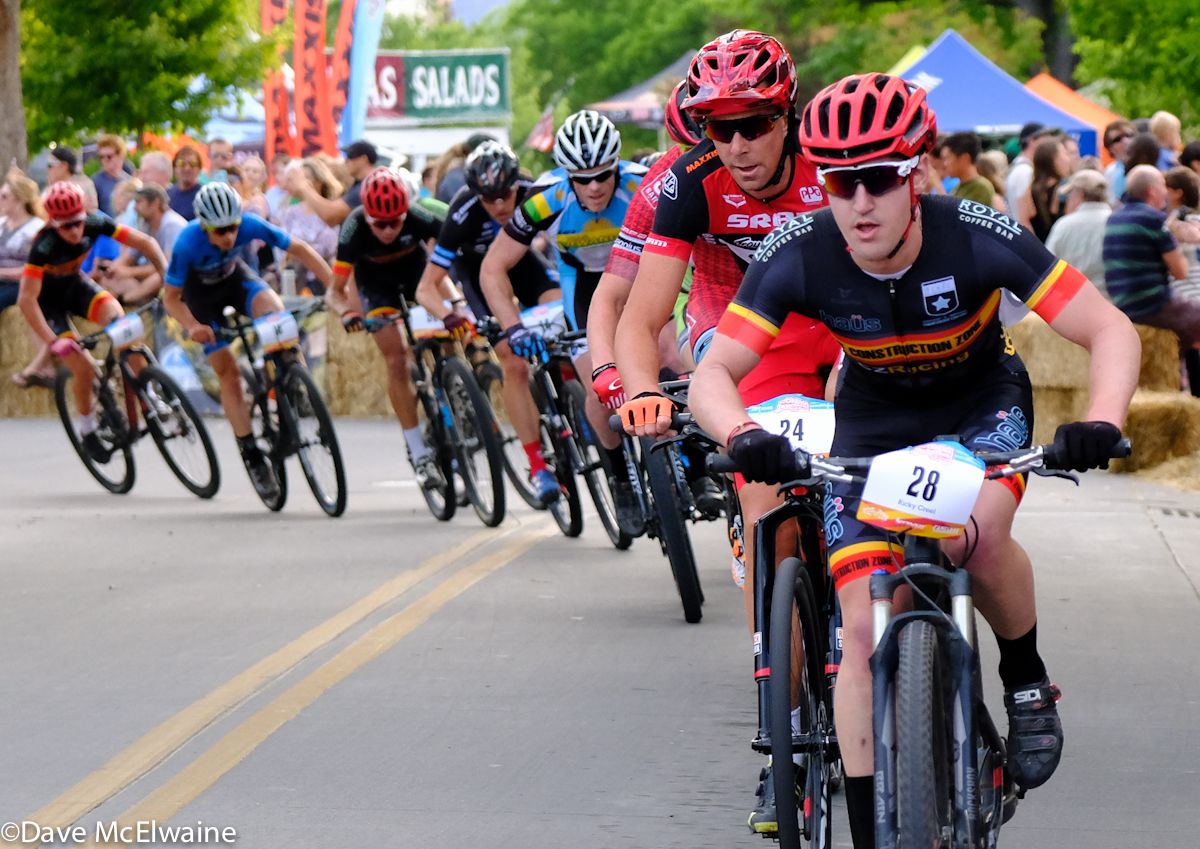 Ricky Creel (CZ Racing) leads a large group that includes Todd Wells through the final turn on the course.