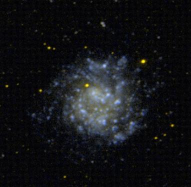 A nebulous blue and gold sprial against a black background