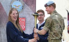 Prince Harry helps light the cauldron as he attends the Opening Ceremony of the Warrior Games in Colorado Springs.