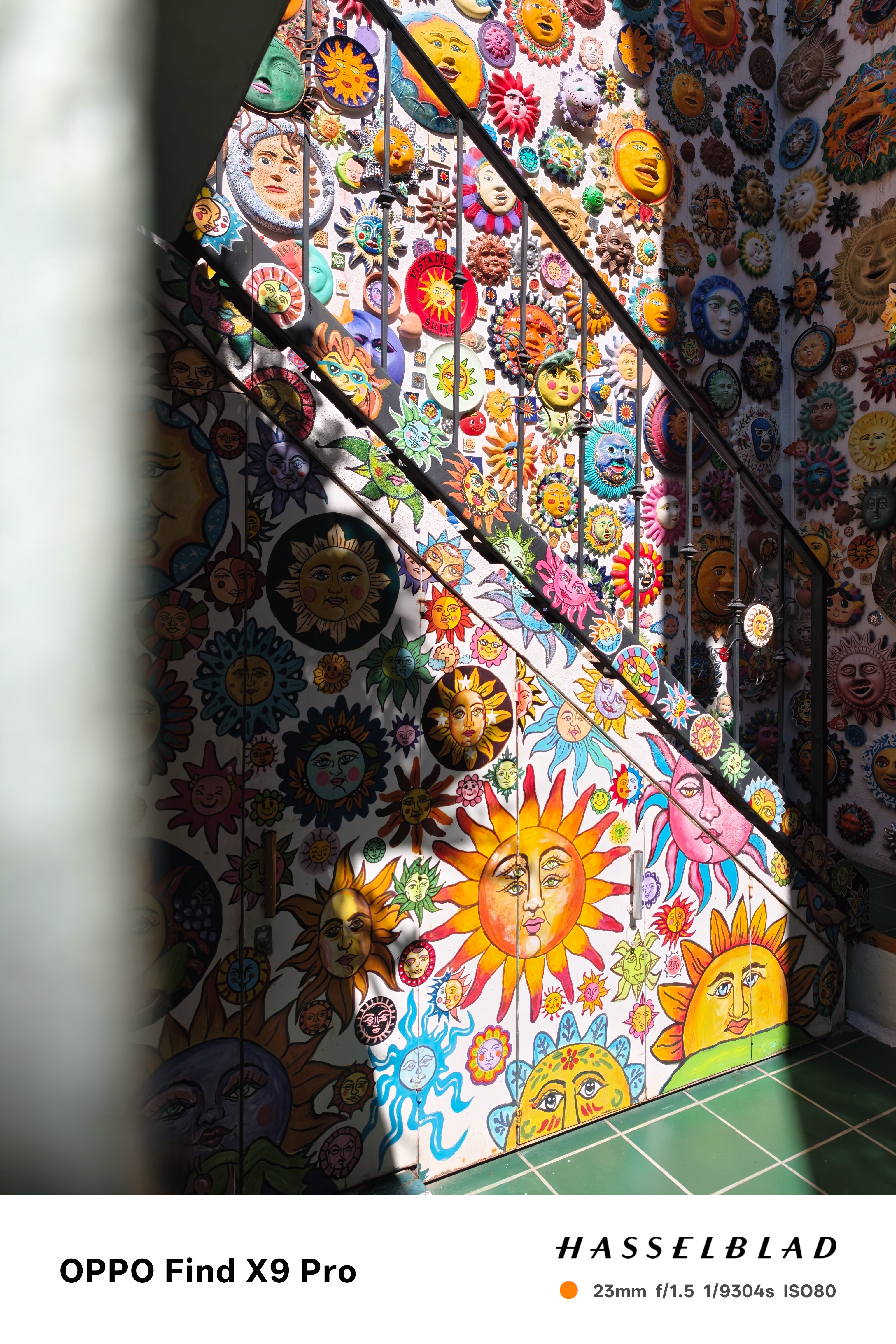 A stairwell covered in dozens of pictures of the sun