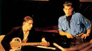 Paul Weller poses with an Ovation acoustic guitar during a Band Aid recording session