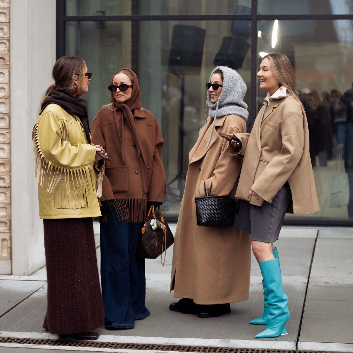 street style shot of four women in winter clothes