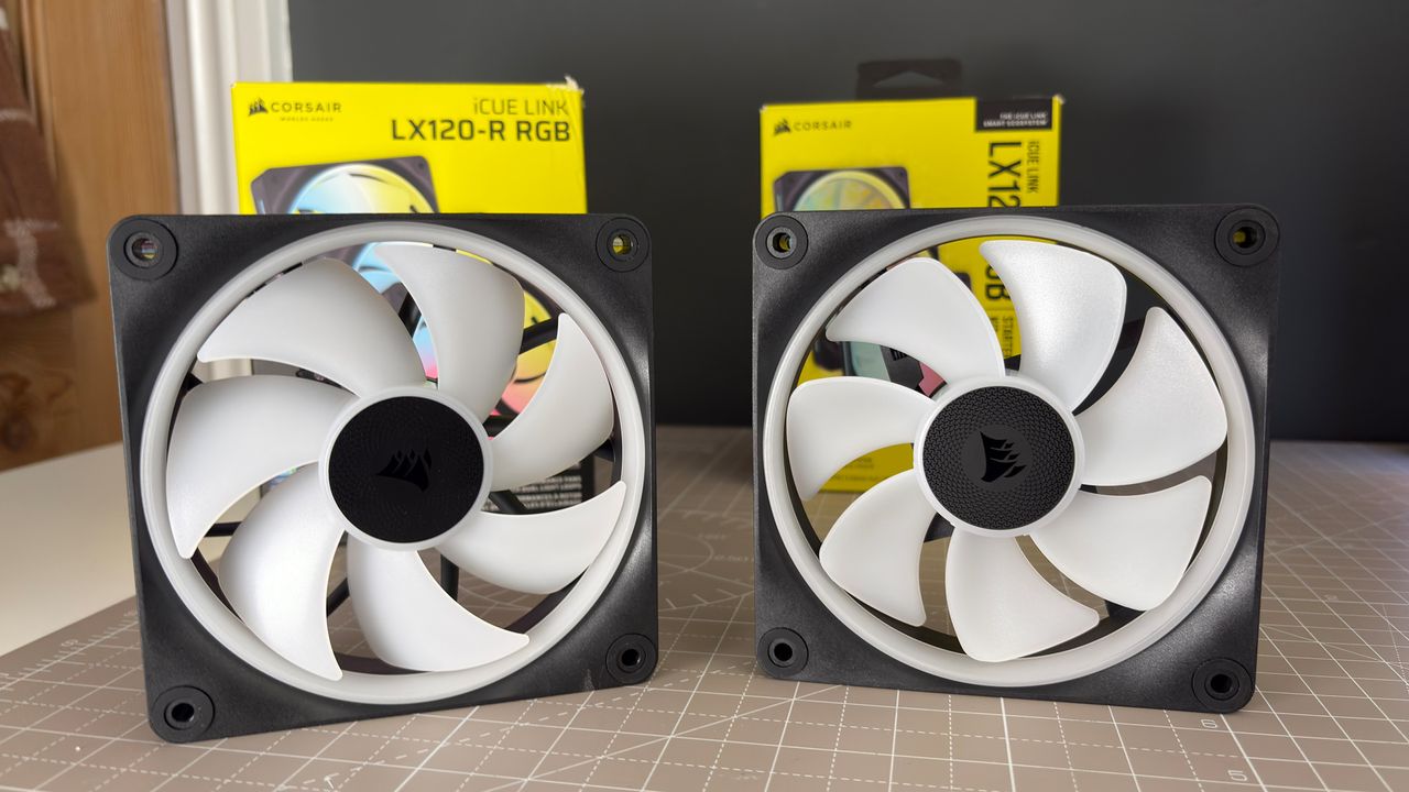 Various PC fans on a table with testing equipment for a round of batch tests.