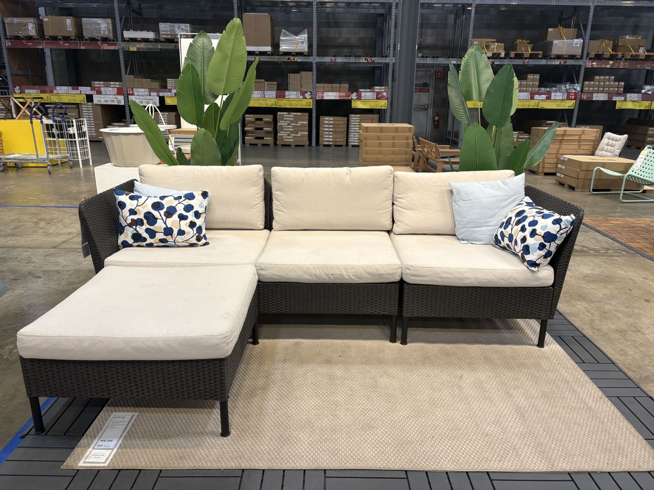an outdoor sofa set with a black frame sitting in an ikea showroom