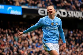 Erling Haaland celebrates after scoring for Manchester City against Everton