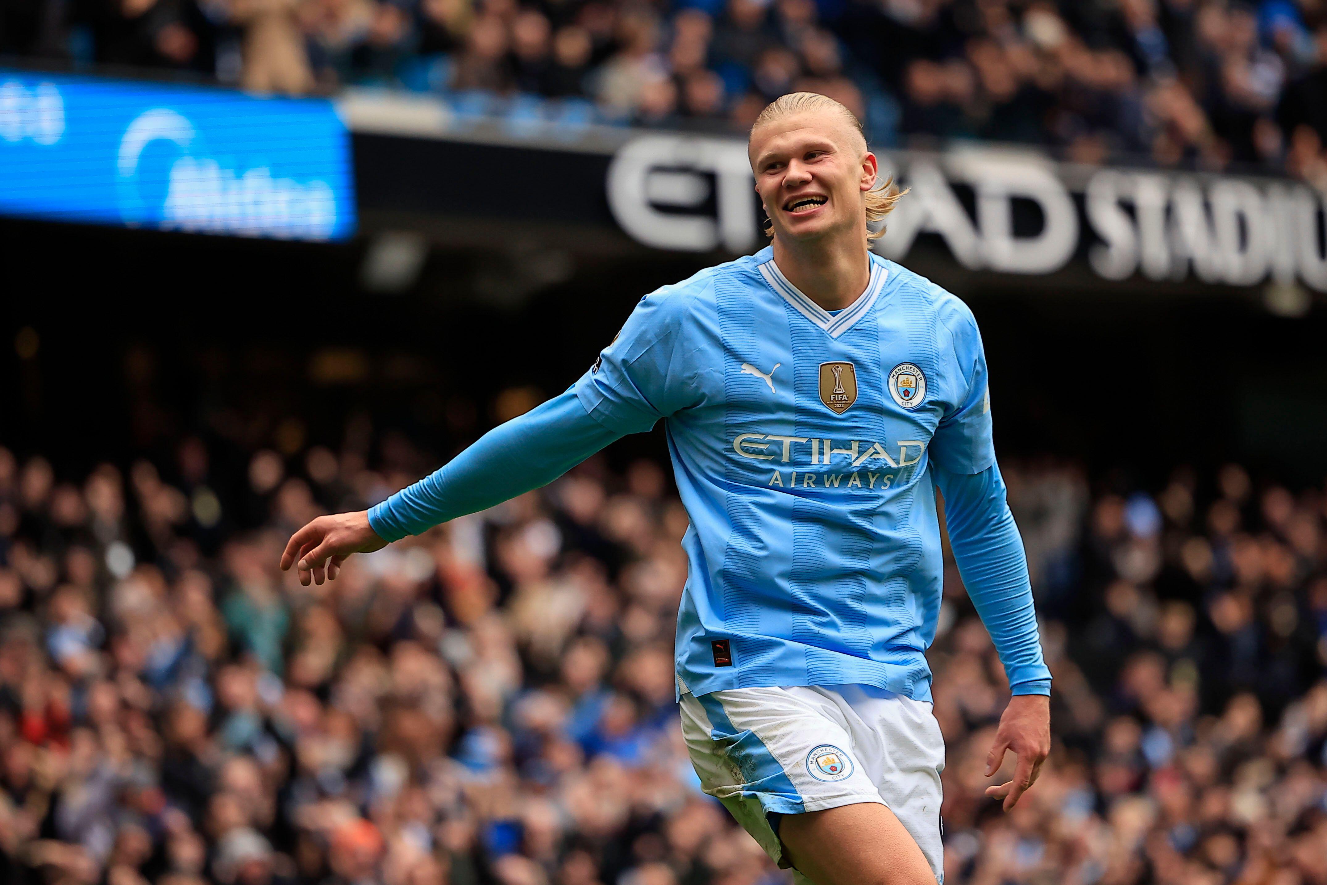 Erling Haaland celebrates after scoring for Manchester City against Everton, 2024