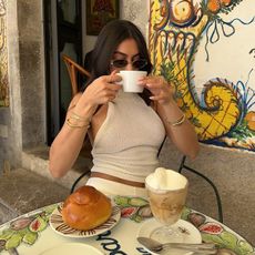 Content creator Mobina Peiman with a coffee, pastry, and affogato in Italy