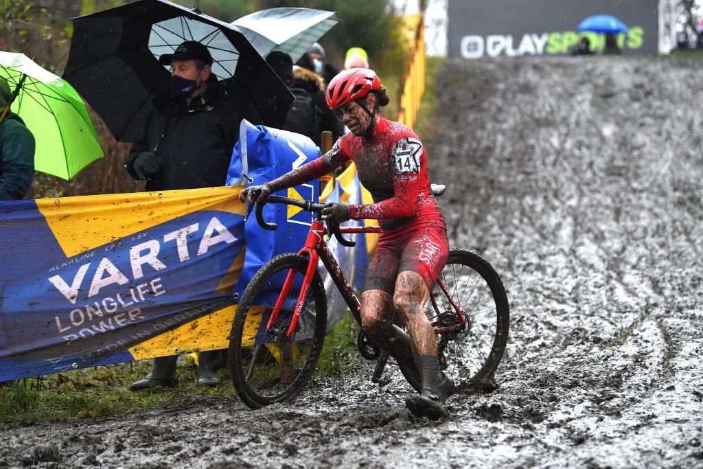 BOOM BELGIUM DECEMBER 04 Marion Norbert Riberolle of Belgium and Starcasino Cx Team competes on a muddy sector during the 7th Superprestige Cyclocross Boom 2021 Womens Elite SPBoom Superprestige2022 on December 04 2021 in Boom Belgium Photo by Luc ClaessenGetty Images