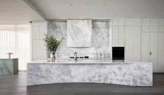 Sculptural stone kitchen island at Horizon Flinders House by Mim Design