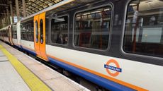 A London Overground train standing by the platform at Liverpool Street station