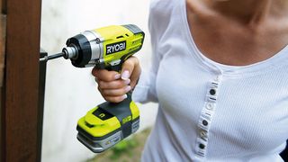 Woman with a Ryobi drill/driver