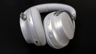 Close-up view of buttons on Bose QuietComfort Ultra headphones.