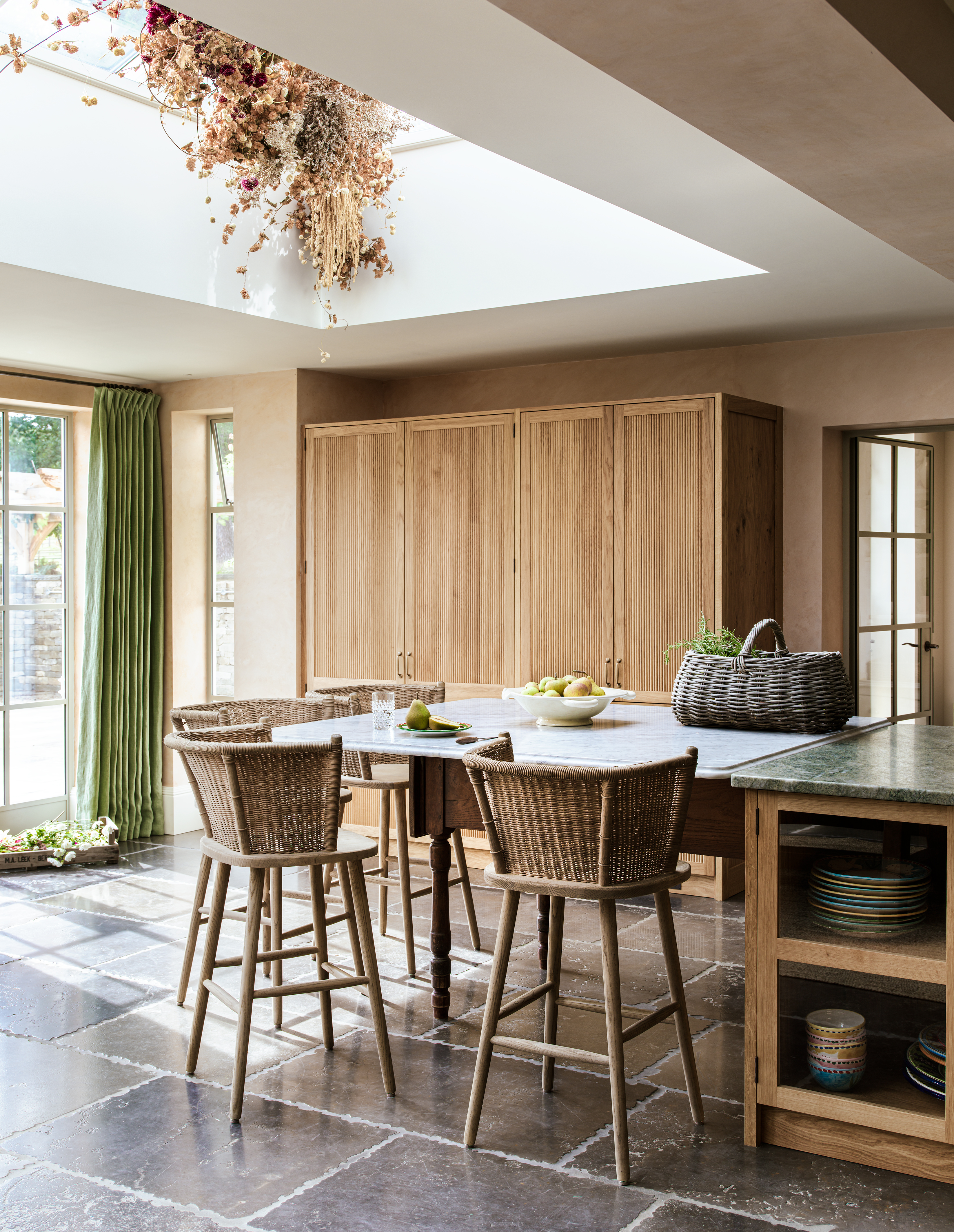 modern extension kitchen with tumbled stone flooring
