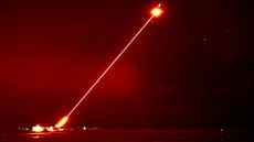 The DragonFire laser shooting at an aerial target.
